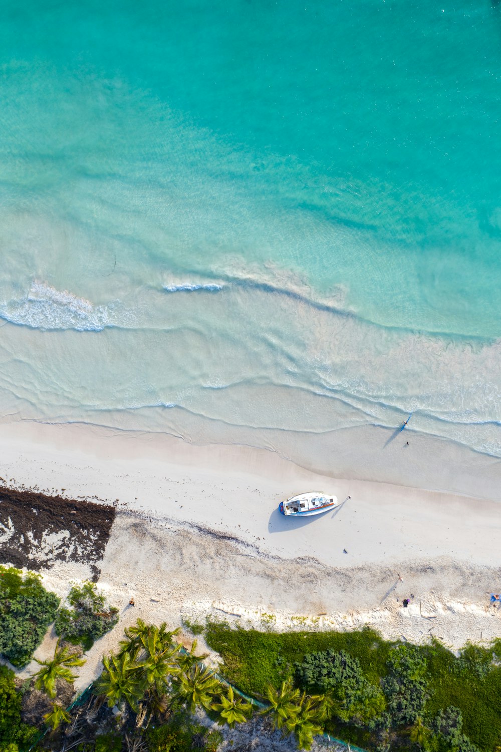 aerial view of white boat on sea during daytime