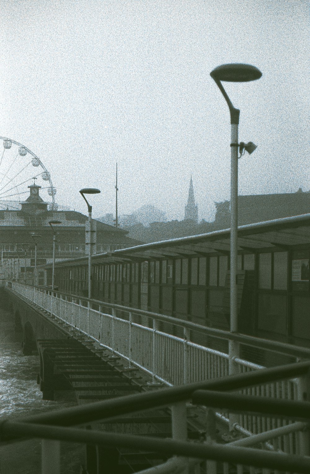 grayscale photo of bridge over river