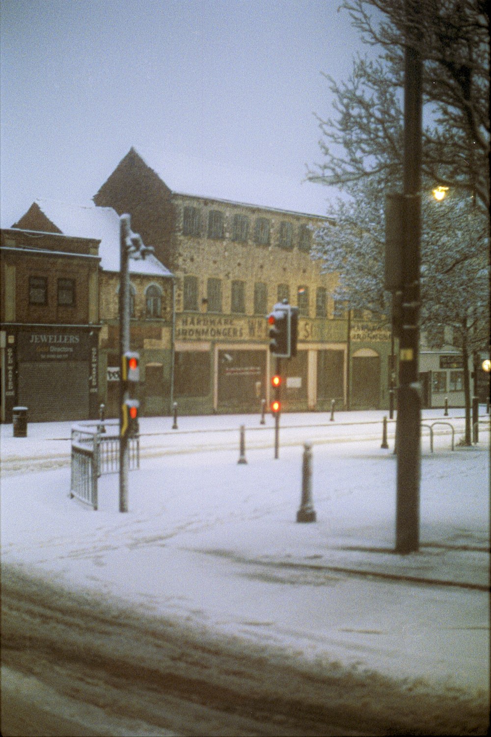 red stop light on snow covered road