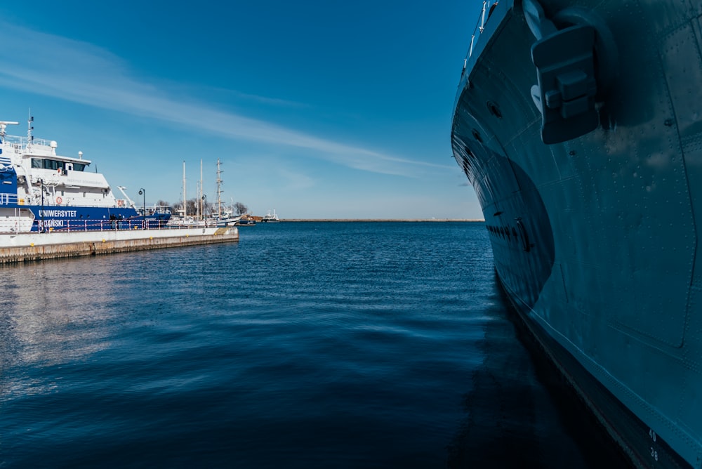 white ship on sea under blue sky during daytime