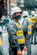 man in black and yellow jacket wearing white helmet