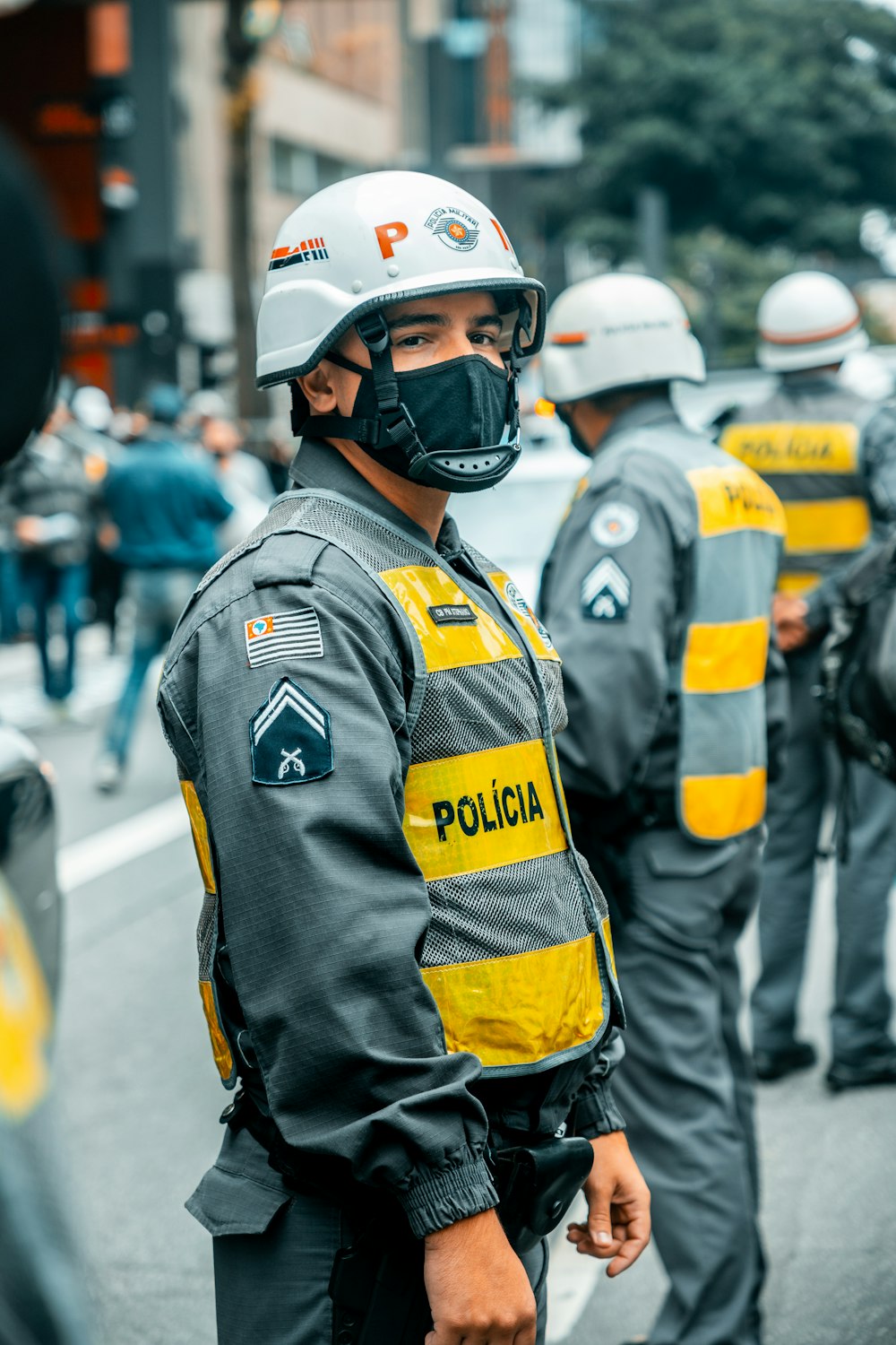 man in black and yellow jacket wearing white helmet