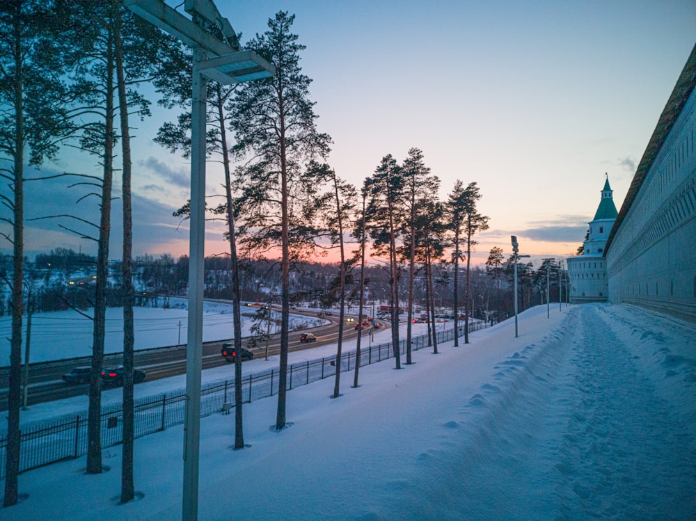 snow covered road during daytime