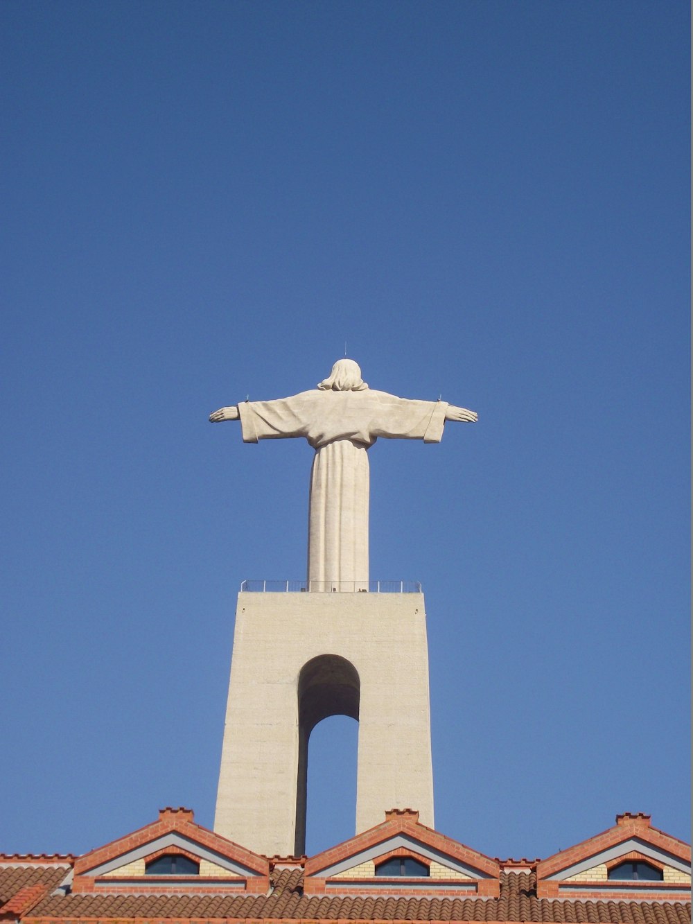 white cross under blue sky during daytime