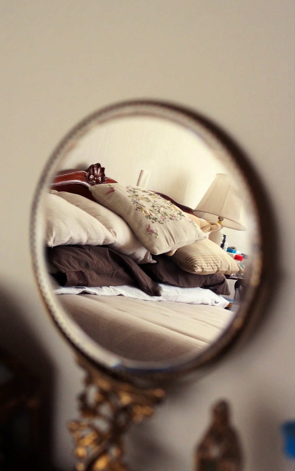 woman in white long sleeve shirt lying on bed