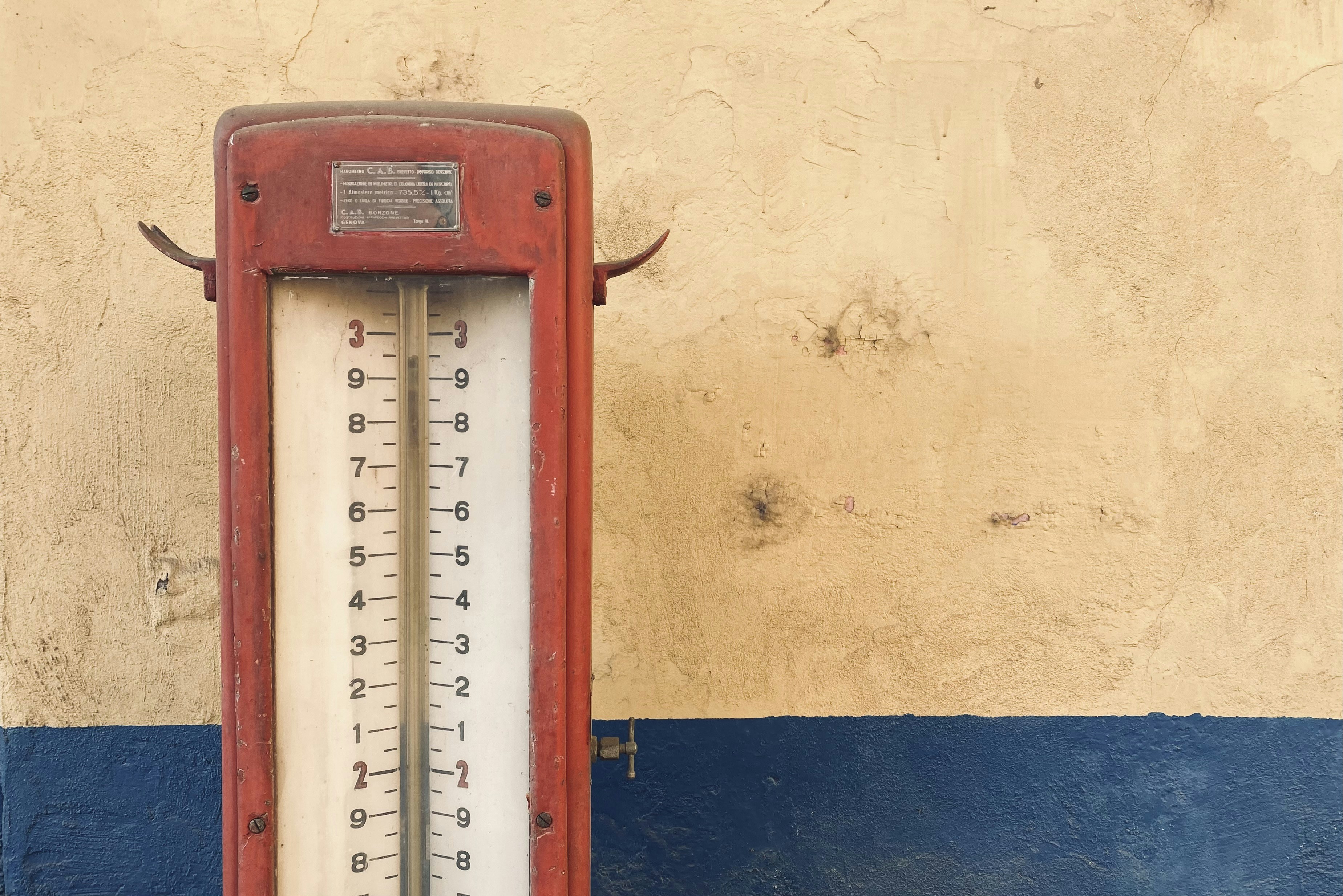 red and white analog wall clock