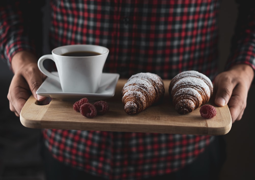 white ceramic mug on brown wooden table