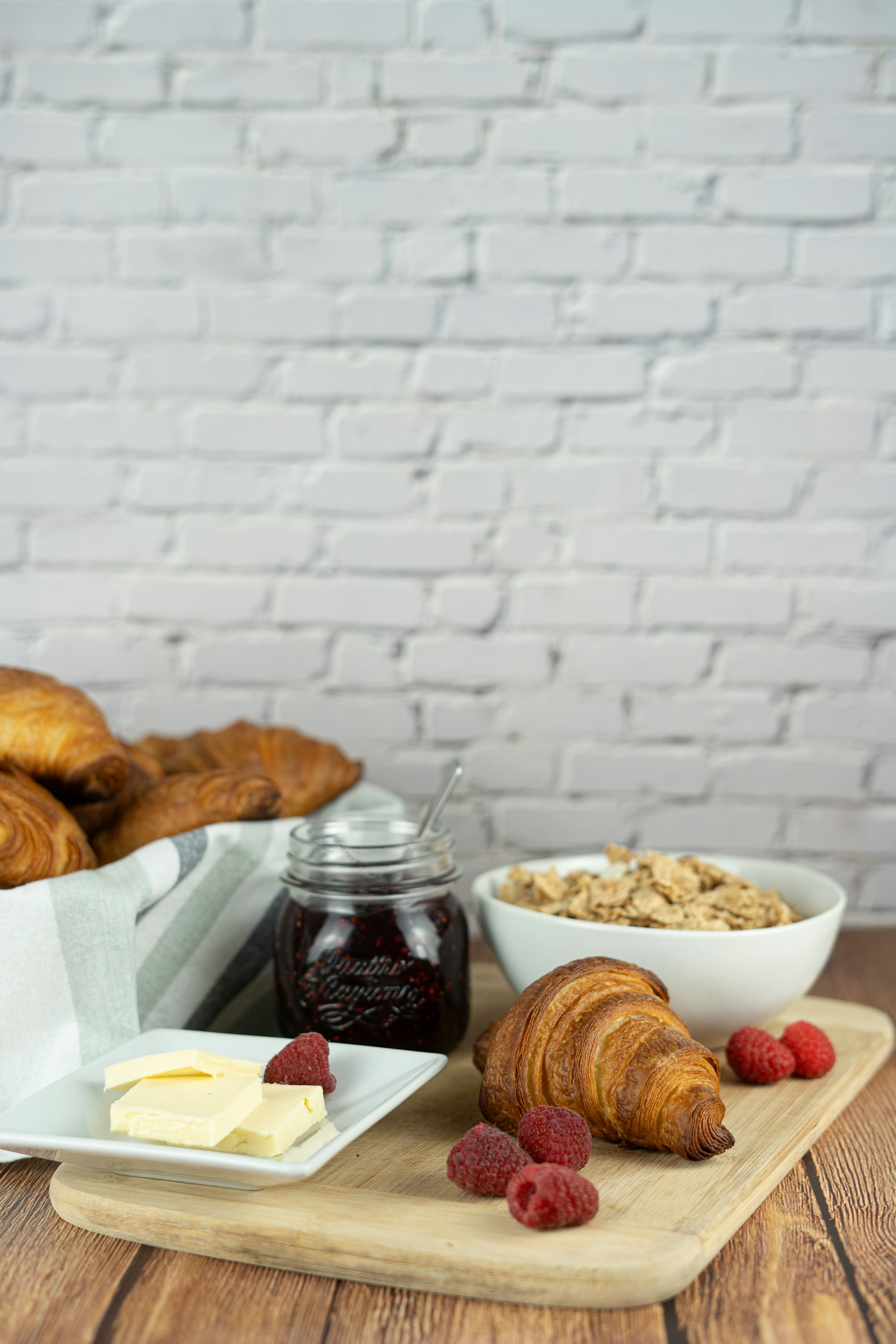 bread on white ceramic bowl beside bread