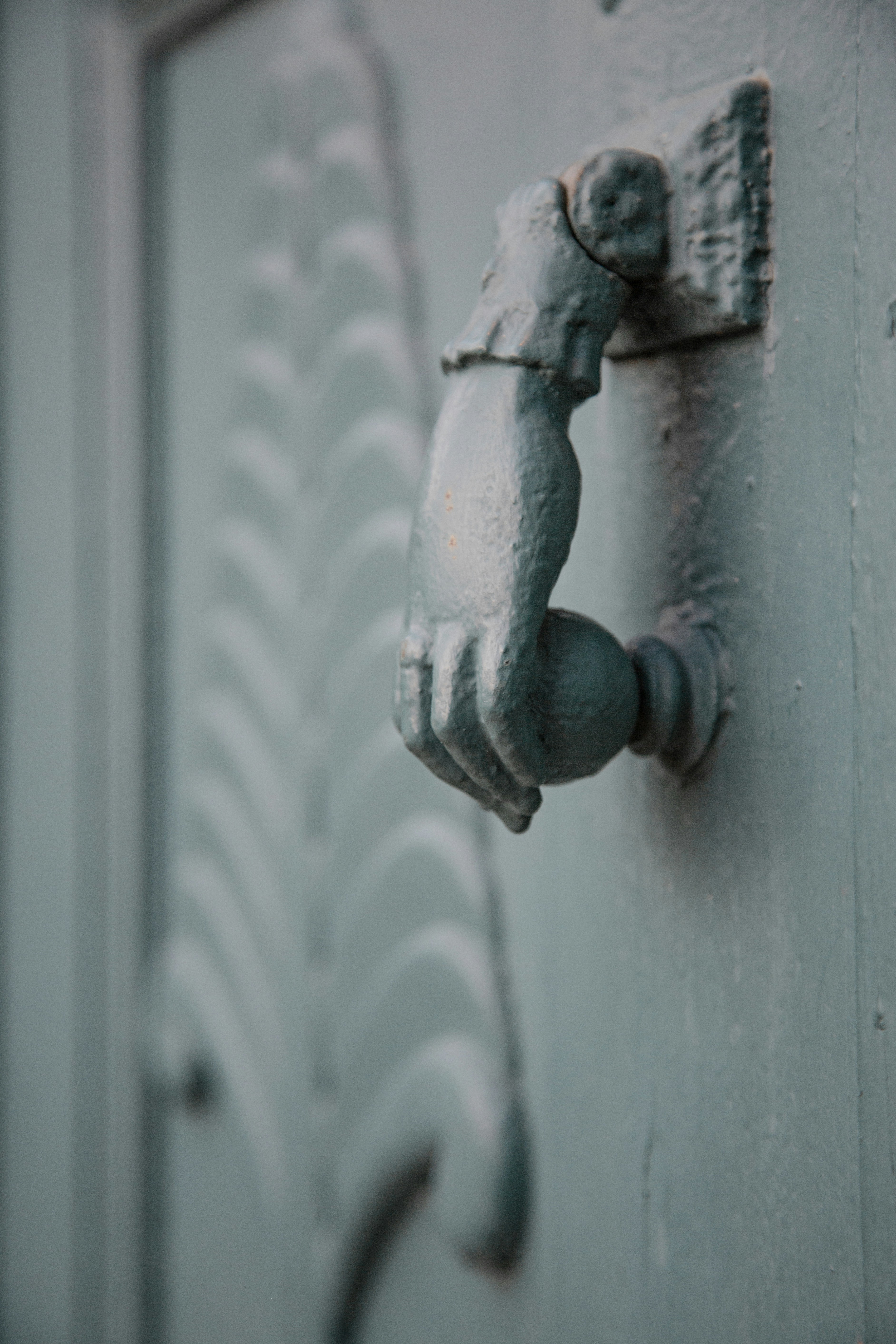 Gray metal door handle on white wooden door photo Free Grey Image on