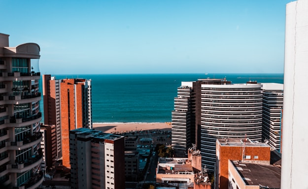 high rise buildings near sea during daytime