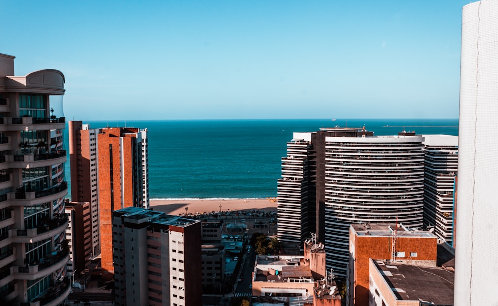 high rise buildings near sea during daytime