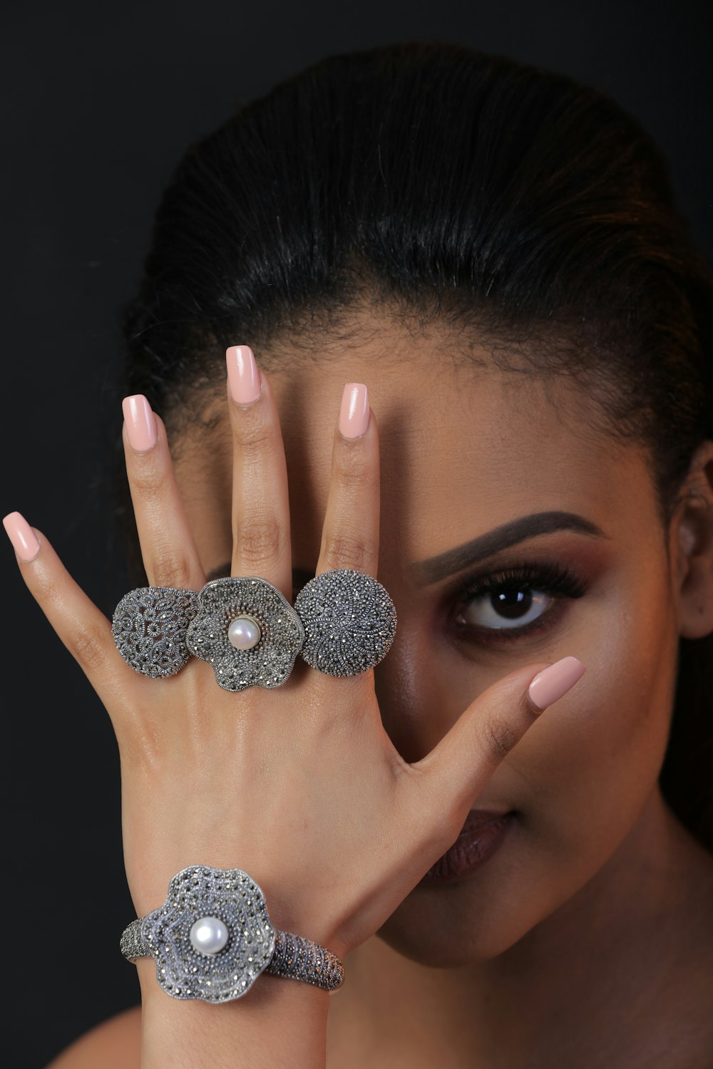 woman with silver and black glitter manicure