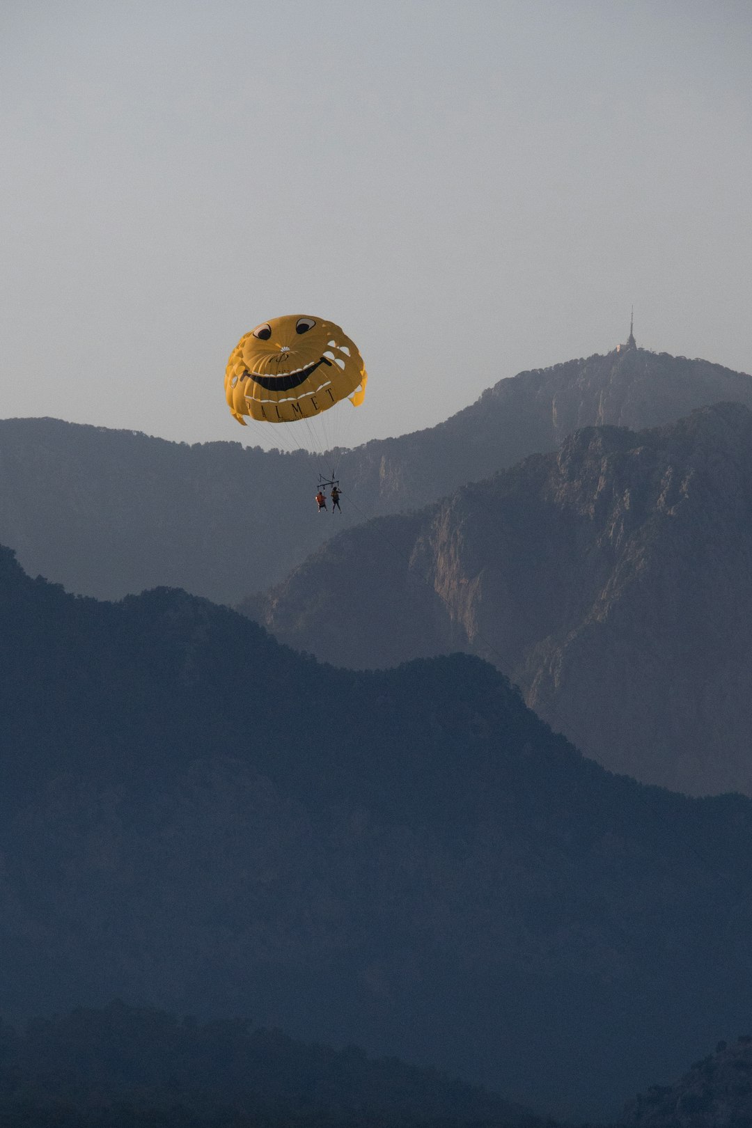 yellow hot air balloon over the mountain