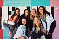 4 women and 2 men smiling