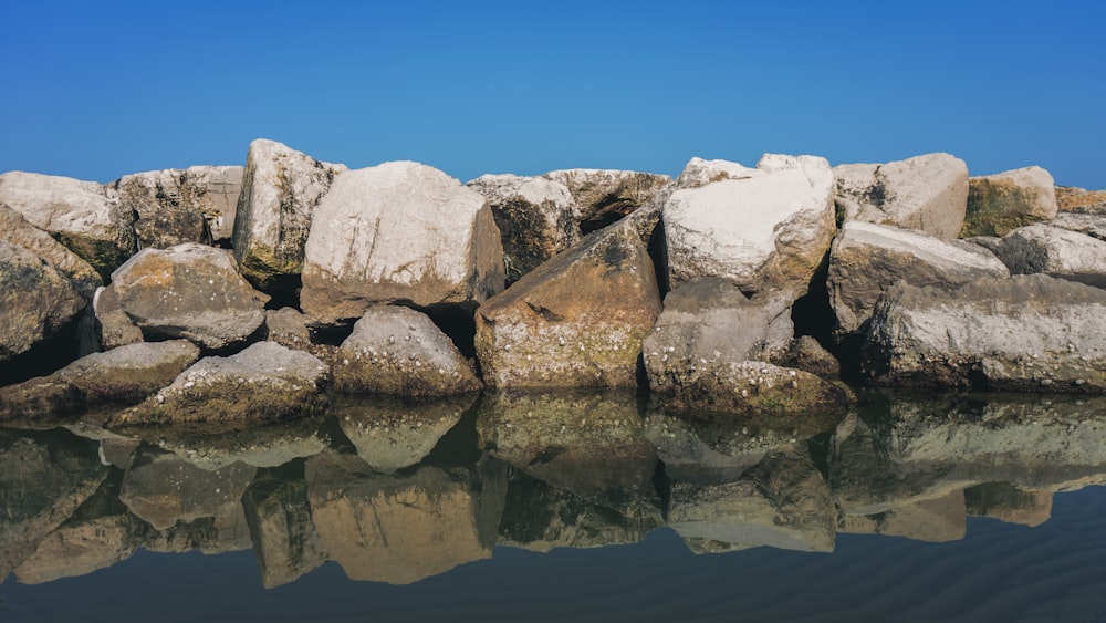 white rock formation on water