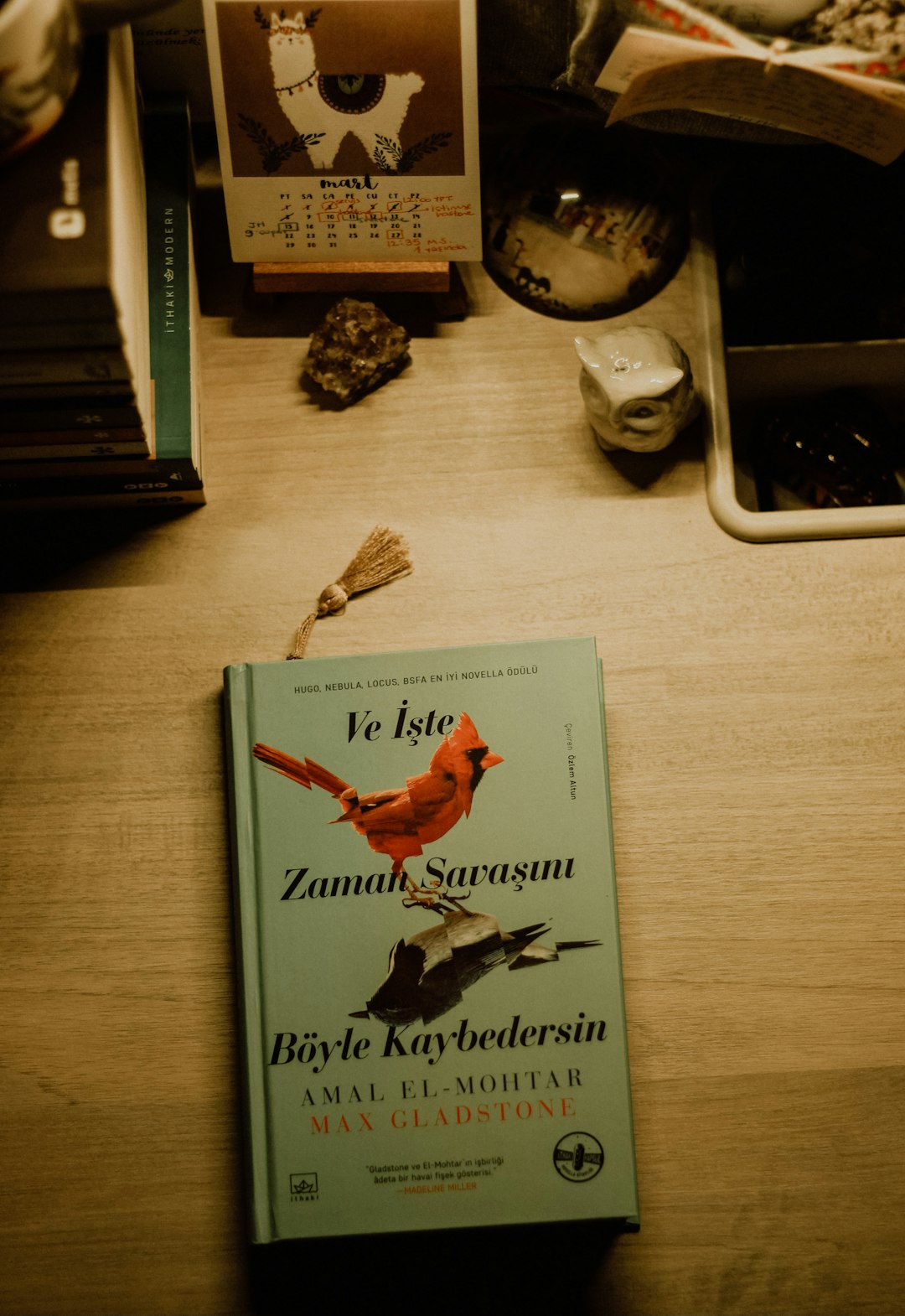 white and red book on brown wooden table