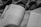 A black and white image of an open book featuring a section header titled 'Quatro meses depois (Agosto de 2011)'. The book has multiple paper tabs inserted along the top edge, and it rests on a patterned surface that appears to be a fabric.