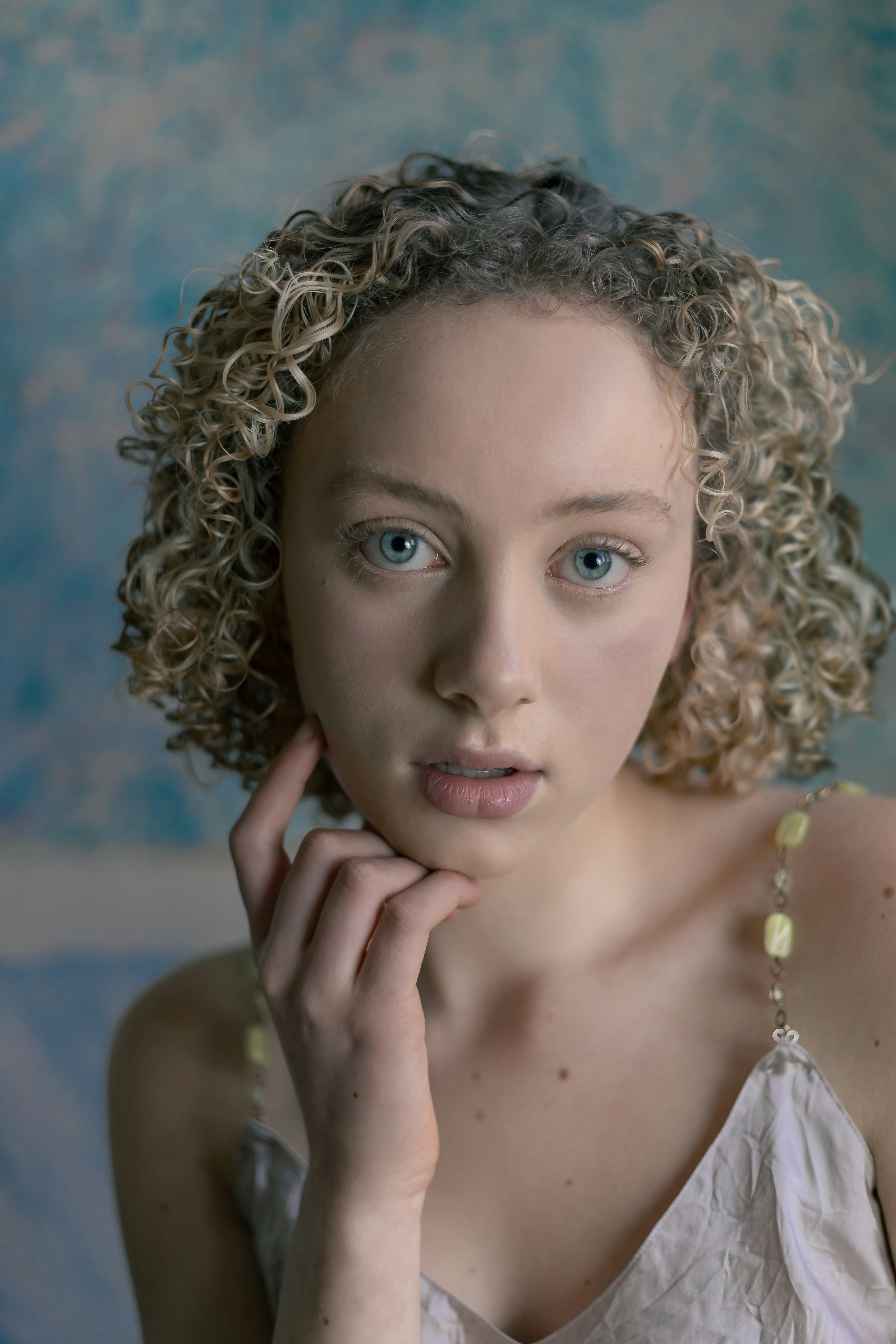 woman in white pearl necklace