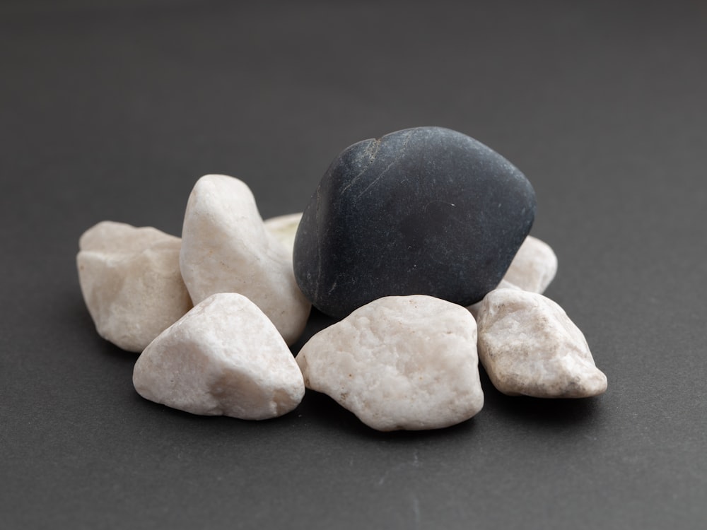 blue and white stones on black surface