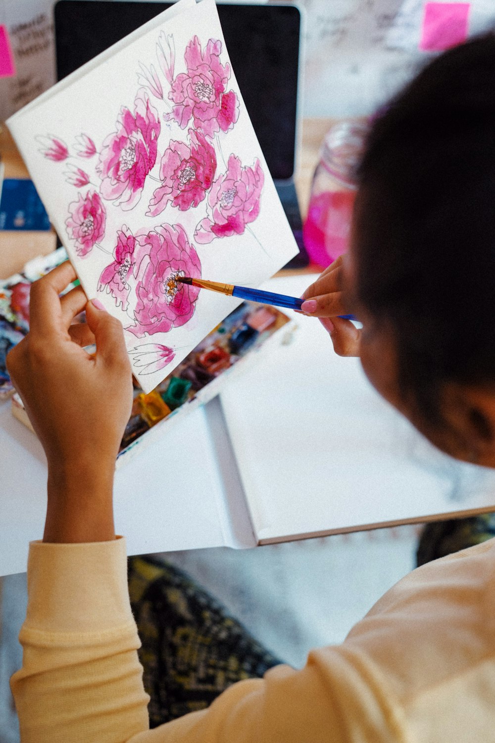 girl drawing on white paper