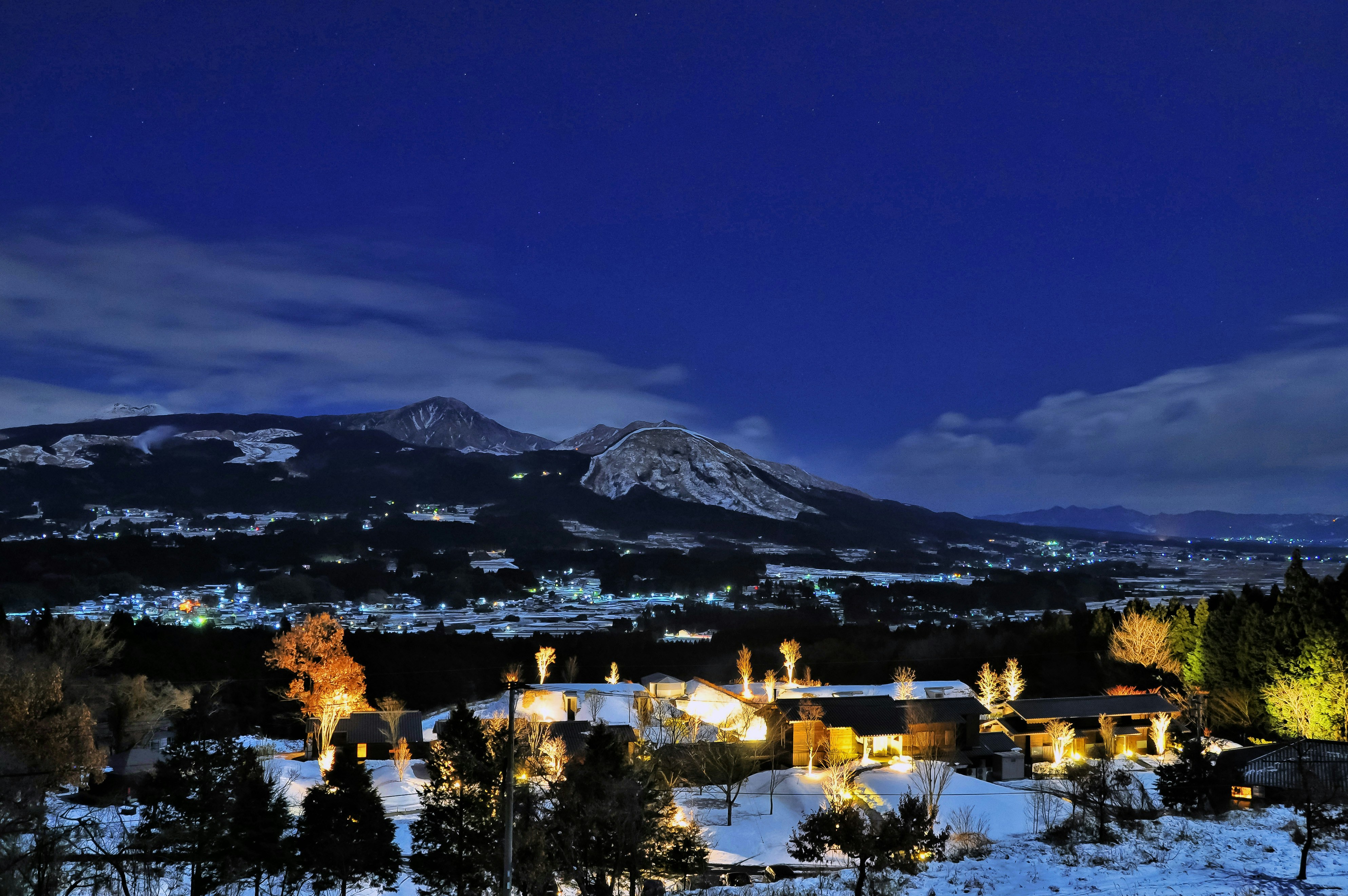 snow covered mountain during night time