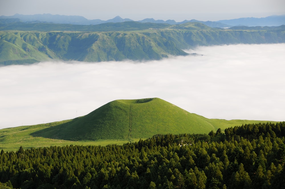 green mountains under white clouds during daytime