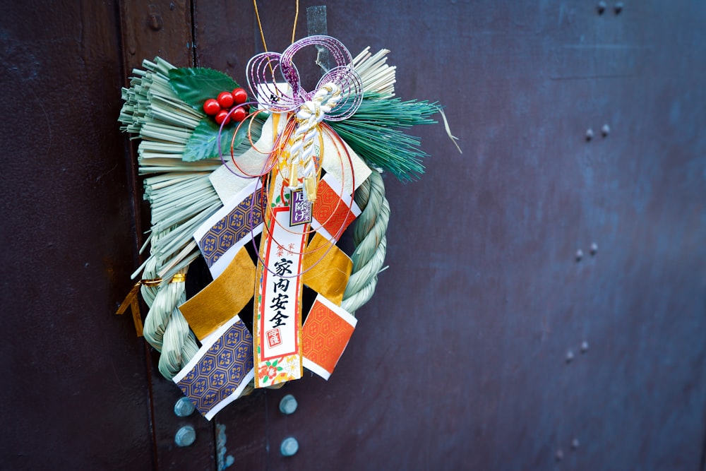 red and green ribbon on black wooden wall