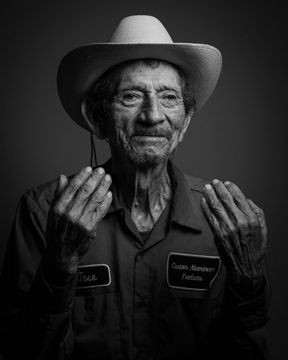 grayscale photo of man wearing cowboy hat