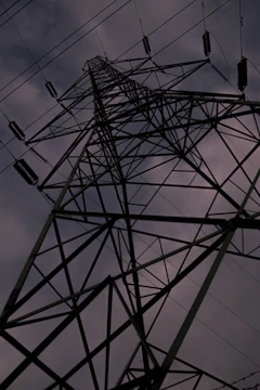 Steel framework rising against a clear sky, symbolizing strength.
