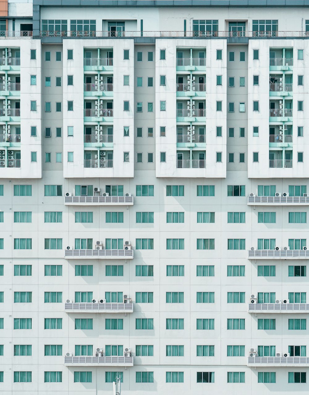 white and teal concrete building