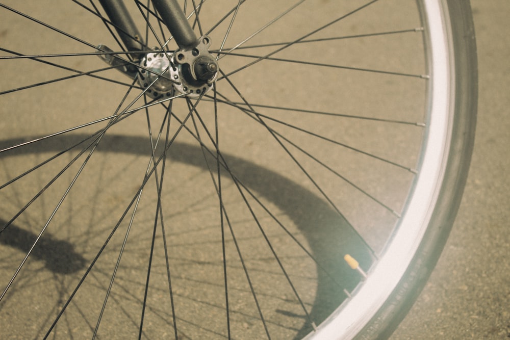 bicycle wheel with tire on brown wooden floor