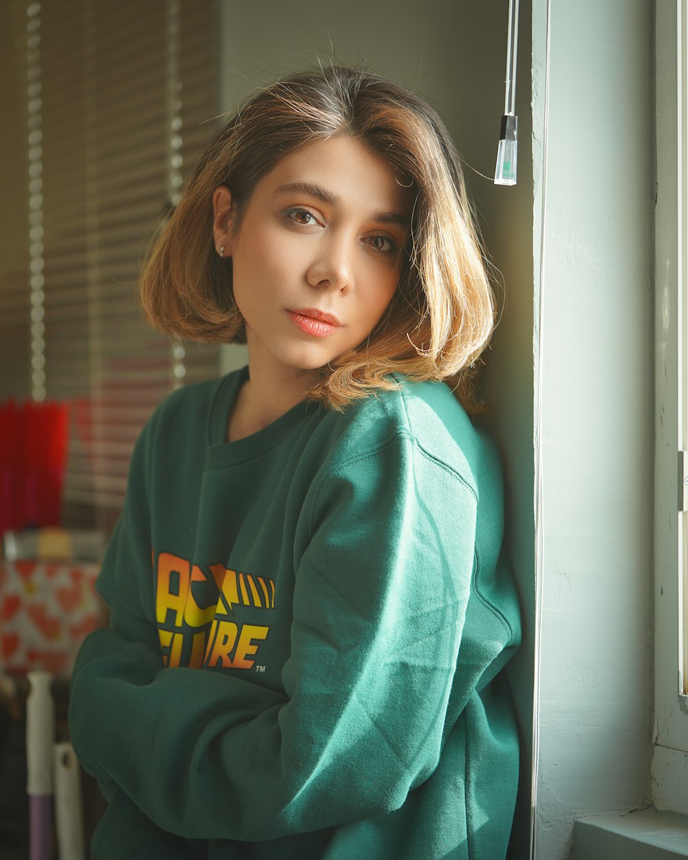 woman in teal and yellow pullover hoodie
