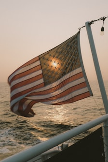 us a flag on white pole
