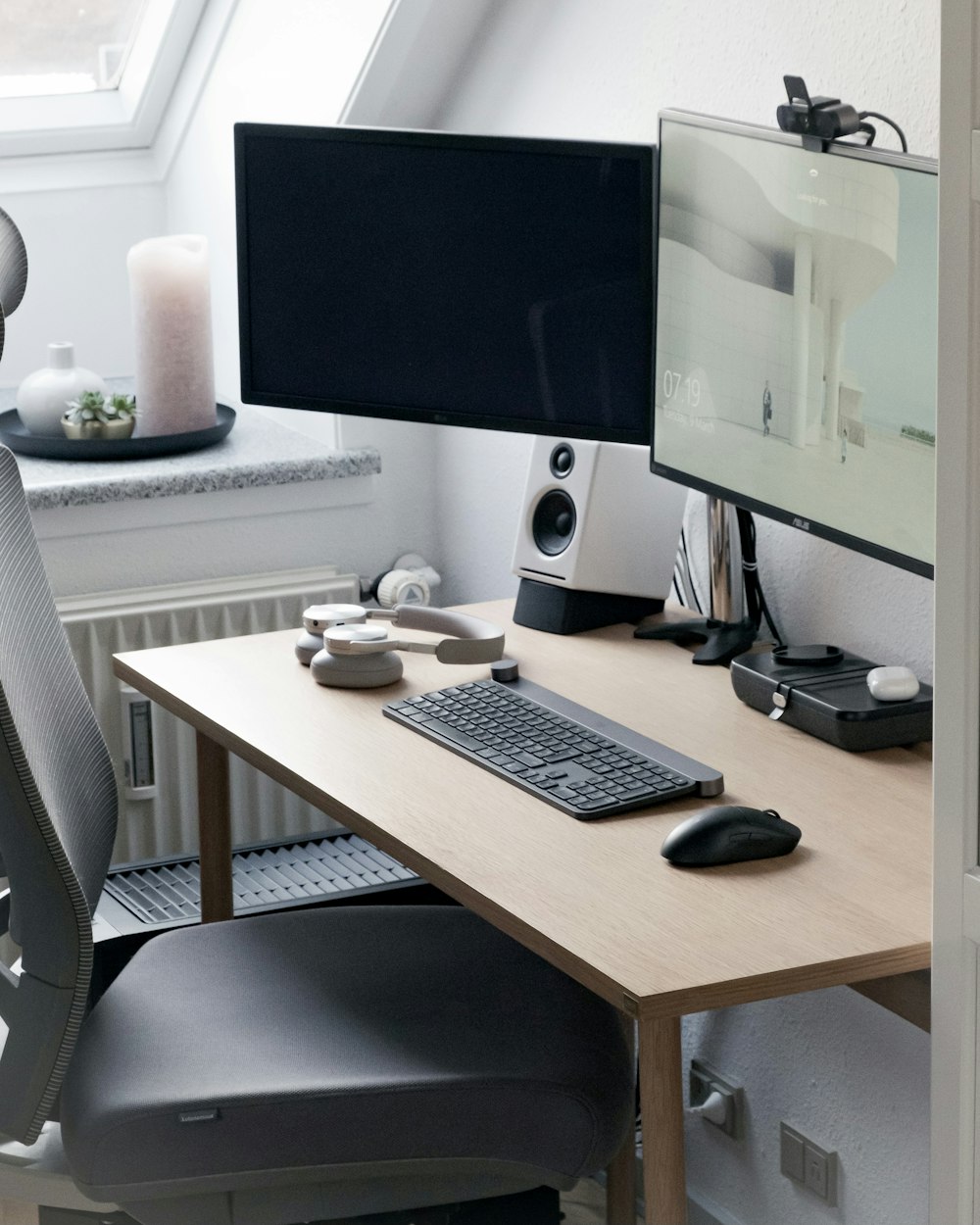 black flat screen computer monitor on brown wooden desk