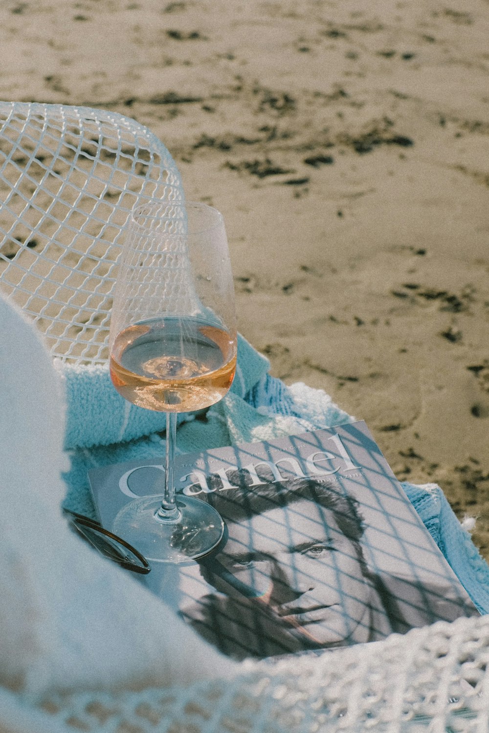 clear wine glass on blue table