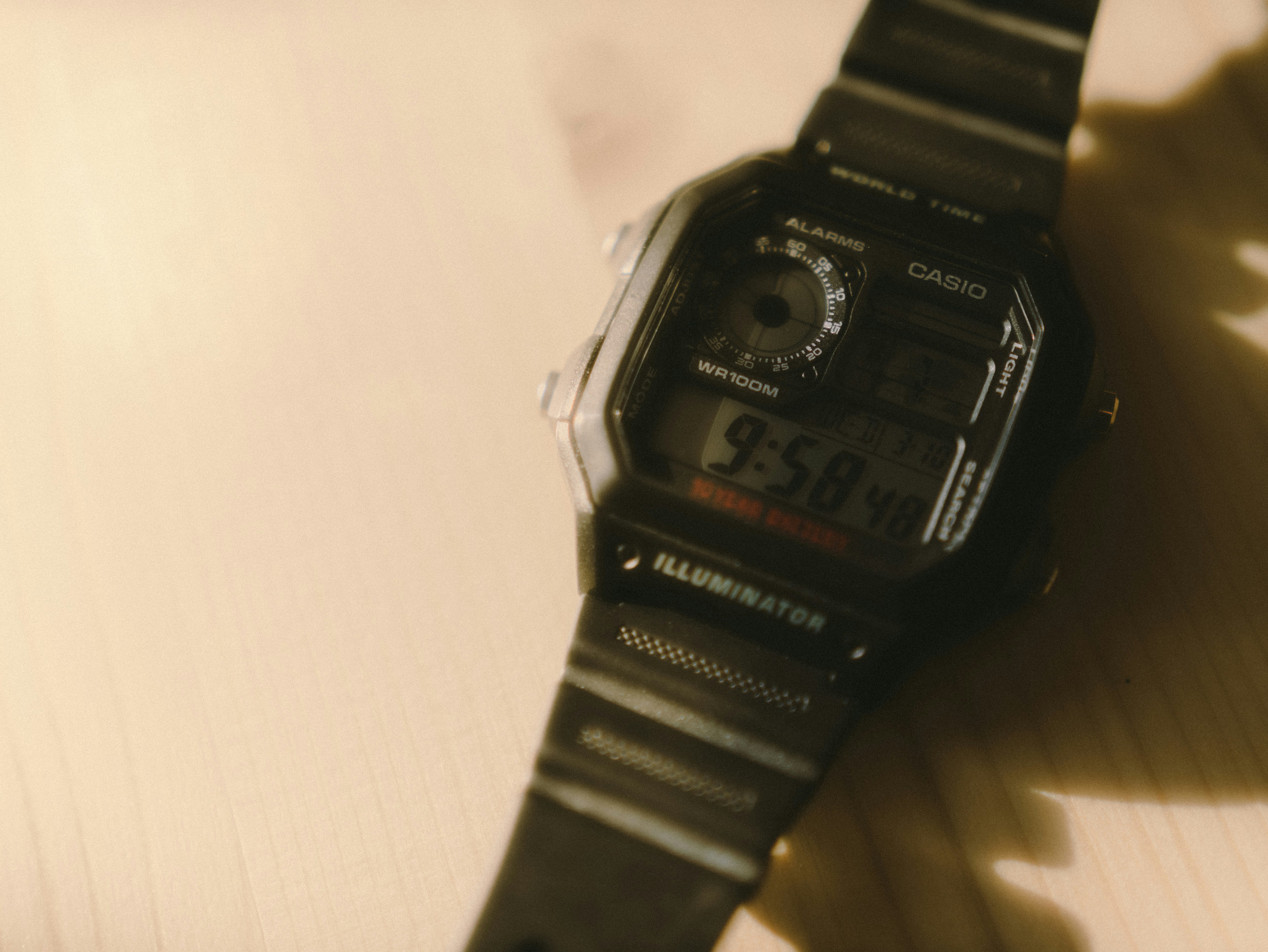 black casio digital watch at 7 00