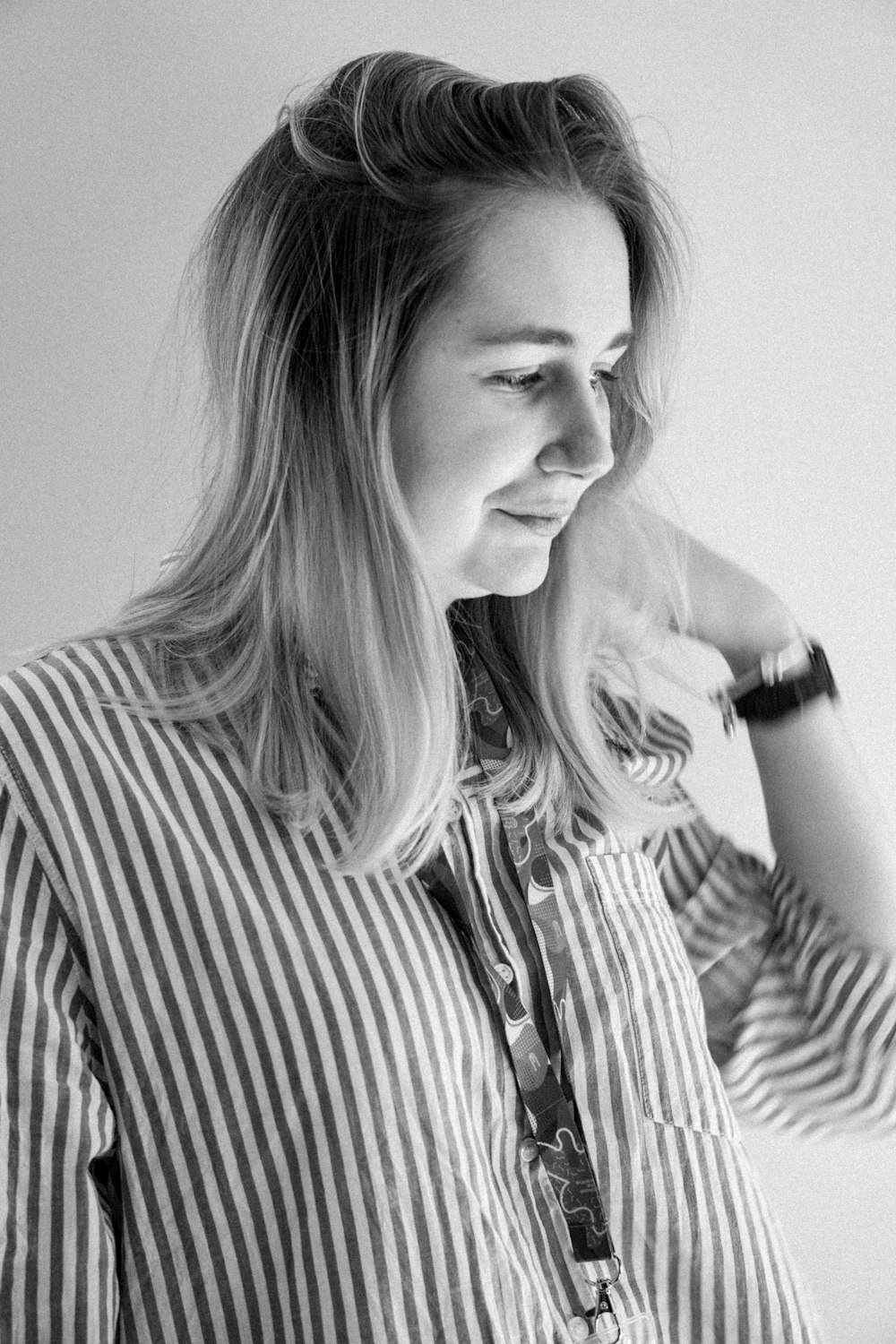 woman in striped dress shirt