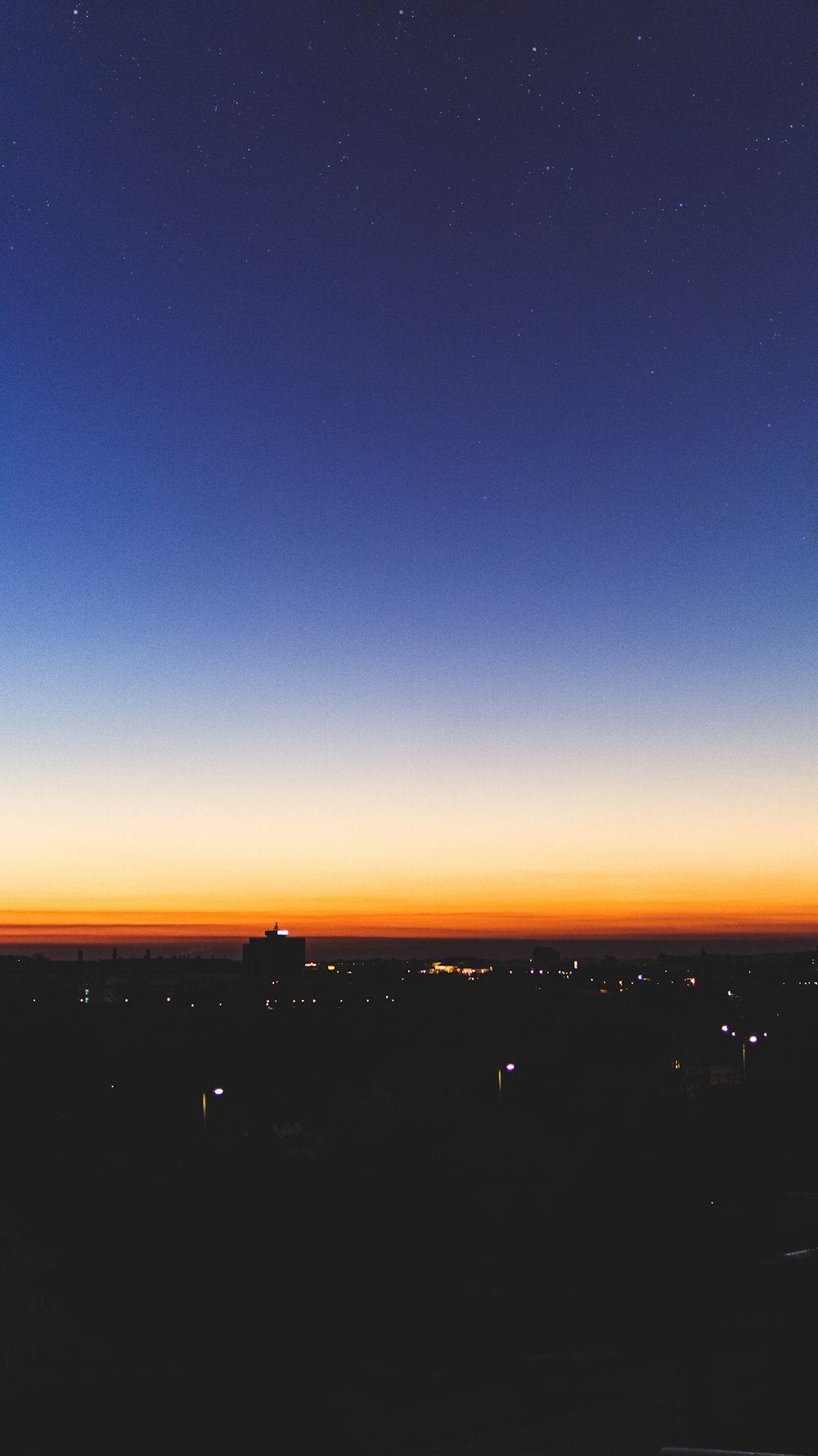 silhouette of city buildings during sunset