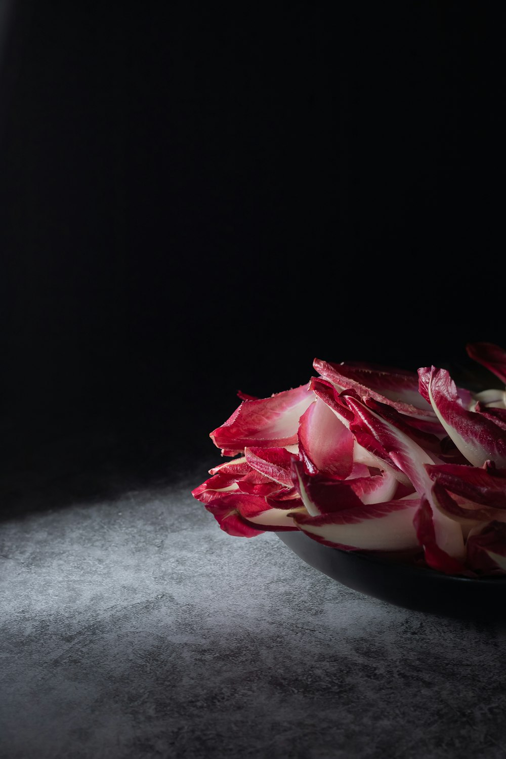 red and white flower on white ceramic bowl