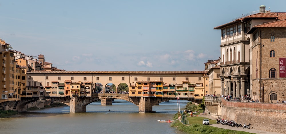 brown concrete bridge over river during daytime