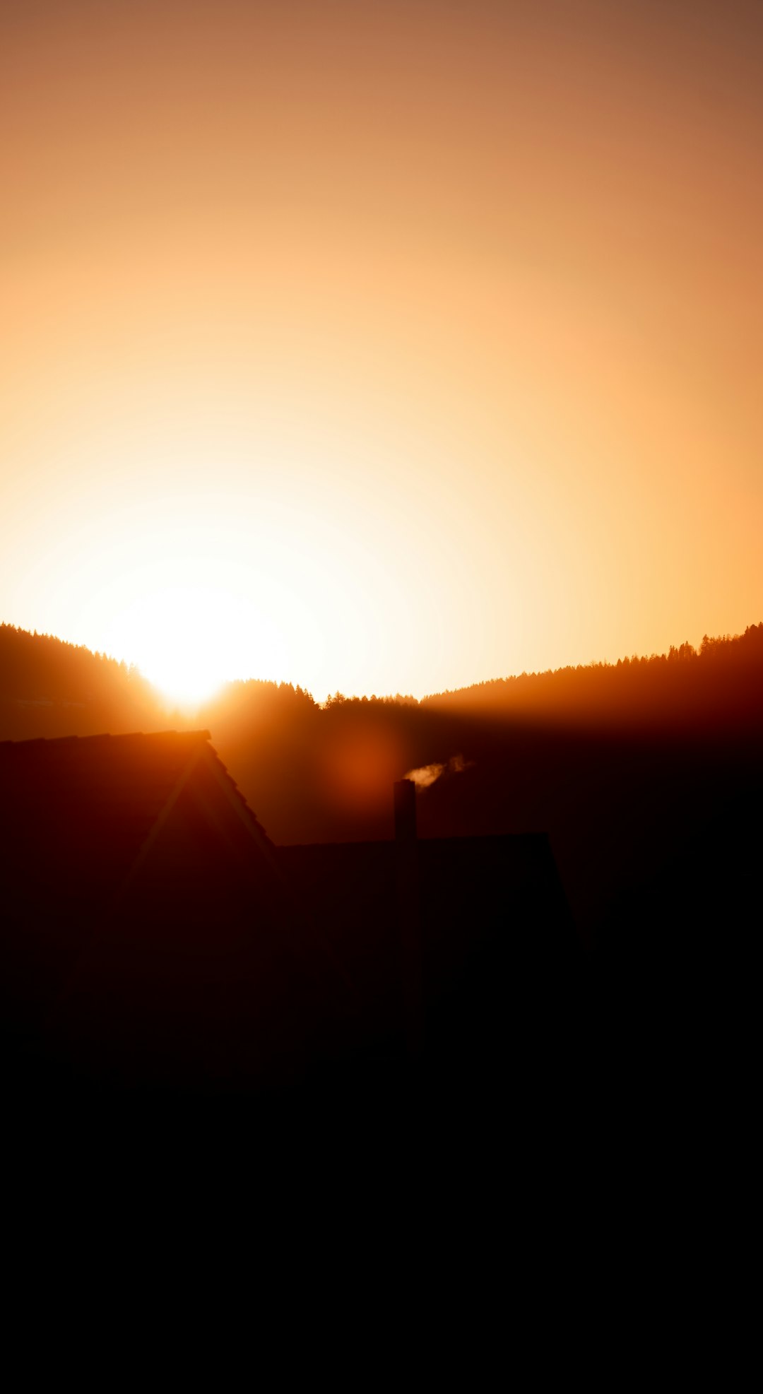 silhouette of house during sunset