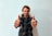 A smiling client giving a thumbs up in an office setting.