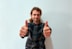A happy customer giving a thumbs up after receiving a personal loan.