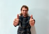 A happy customer giving a thumbs up after receiving a personal loan.