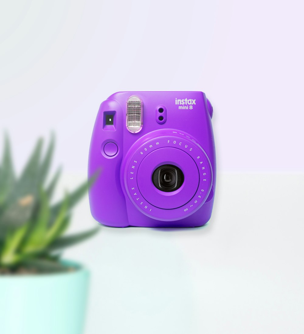 purple nikon point and shoot camera