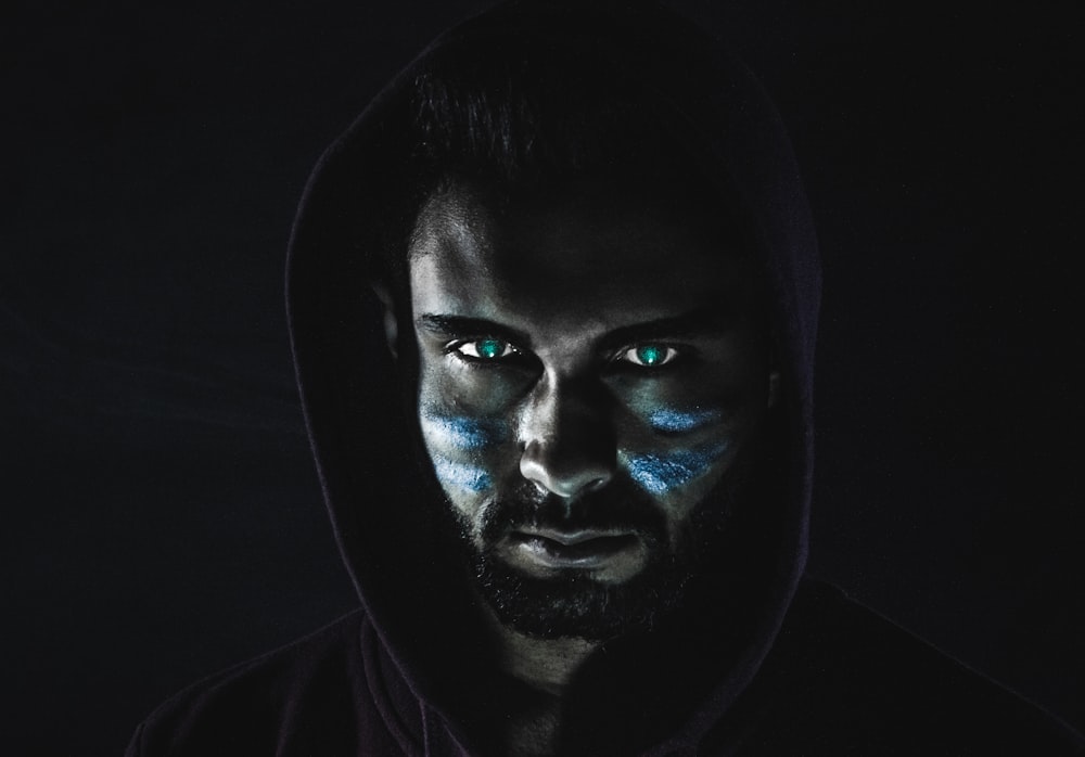 Premium Photo  A black man with blue eyes and a black background