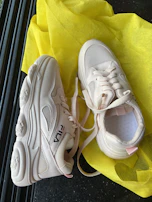 Sporty running shoes with breathable mesh fabric showcased on a clean white background.