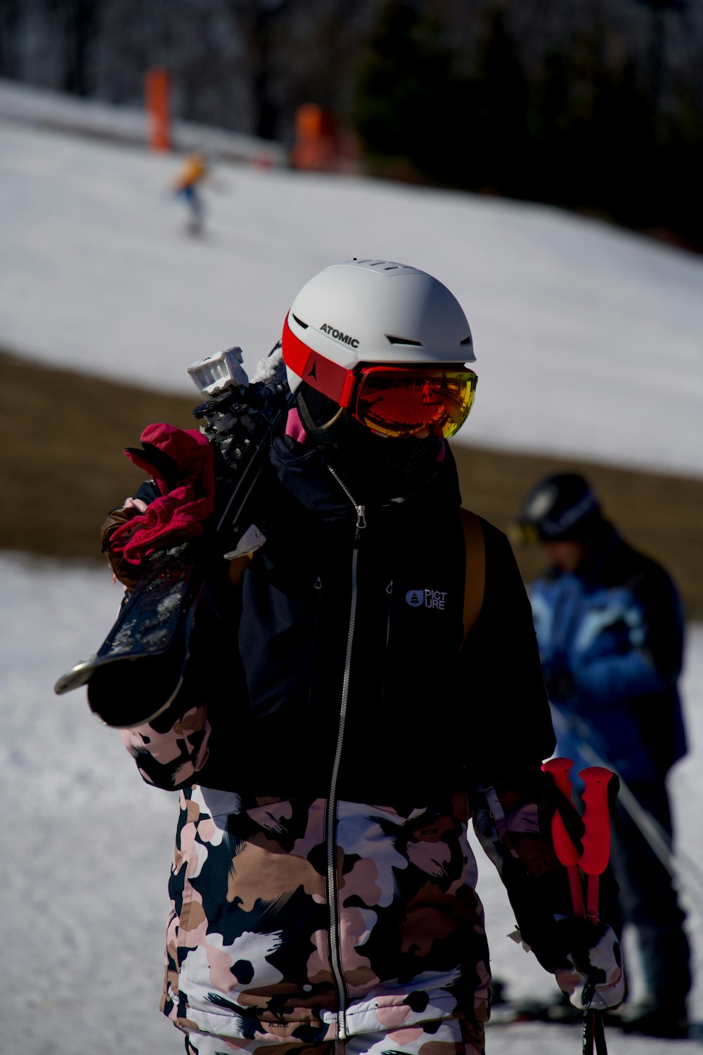 person in black and white jacket wearing white helmet