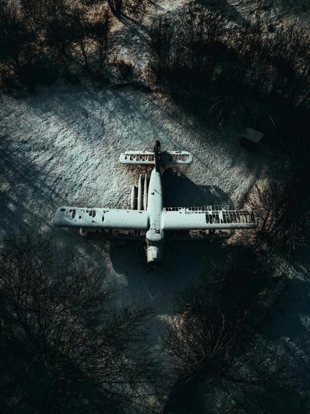 white jet plane on black and white surface