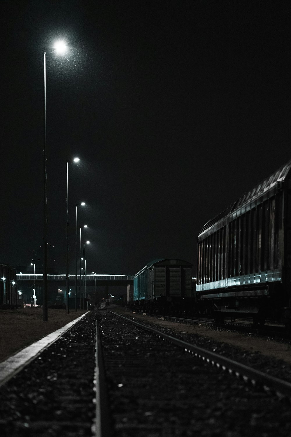 train station with lights turned on during night time